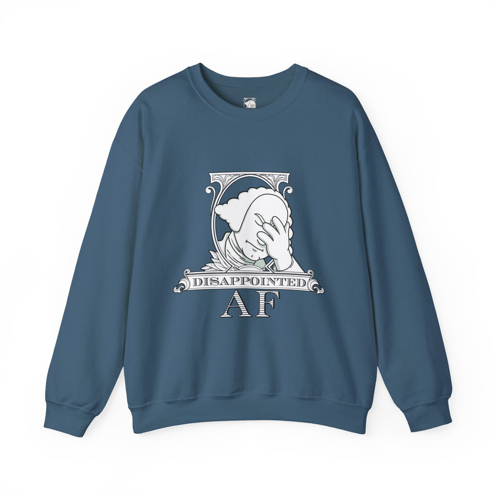 A slate blue, long-sleeved sweatshirt with a graphic in the center on a white background. This graphic is the logo for Disappointed AF and is framed with scrolls, similar to that of a dollar bill, with George Washington in the center. George Washington looks disappointed and has his head in his hand. below the logo it says Disappointed AF