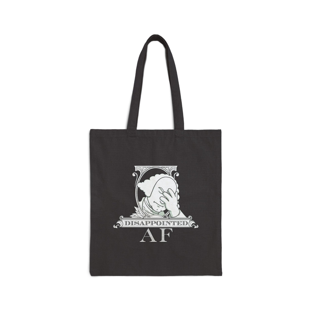 A black canvas tote bag with two black shoulder straps, featuring a white version of the Disappointed AF logo.  The logo for Disappointed AF is framed with scrolls, similar to that of a dollar bill, with George Washington in the center. George Washington looks disappointed and has his head in his hand. below the logo it says Disappointed AF.
