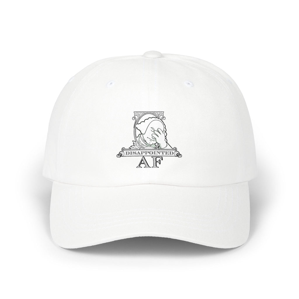 A white baseball cap with a white graphic on the front depicting Disappointed AF's logo. The logo is framed with scrolls, similar to that of a dollar bill, with George Washington in the center. George Washington looks disappointed and has his head in his hand.