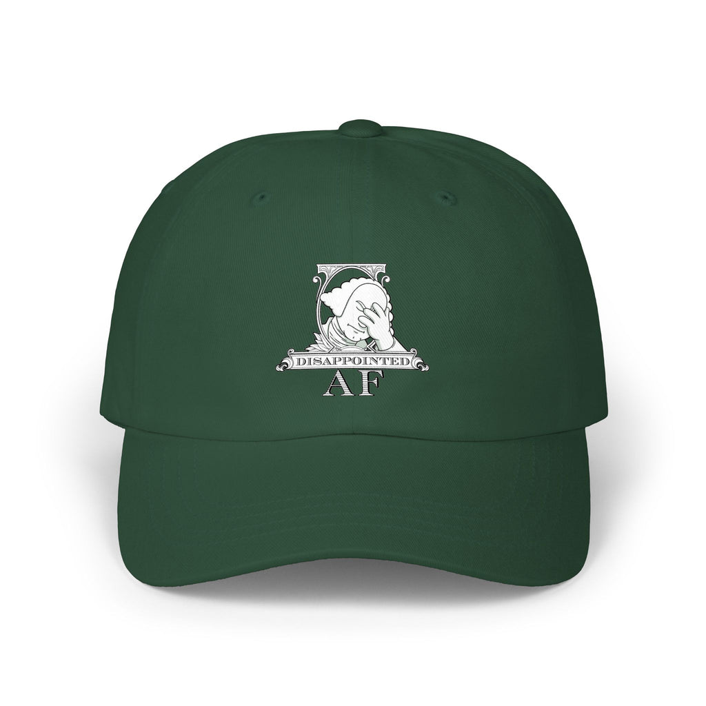 A dark green baseball cap with a white graphic on the front depicting Disappointed AF's logo. The logo is framed with scrolls, similar to that of a dollar bill, with George Washington in the center. George Washington looks disappointed and has his head in his hand.