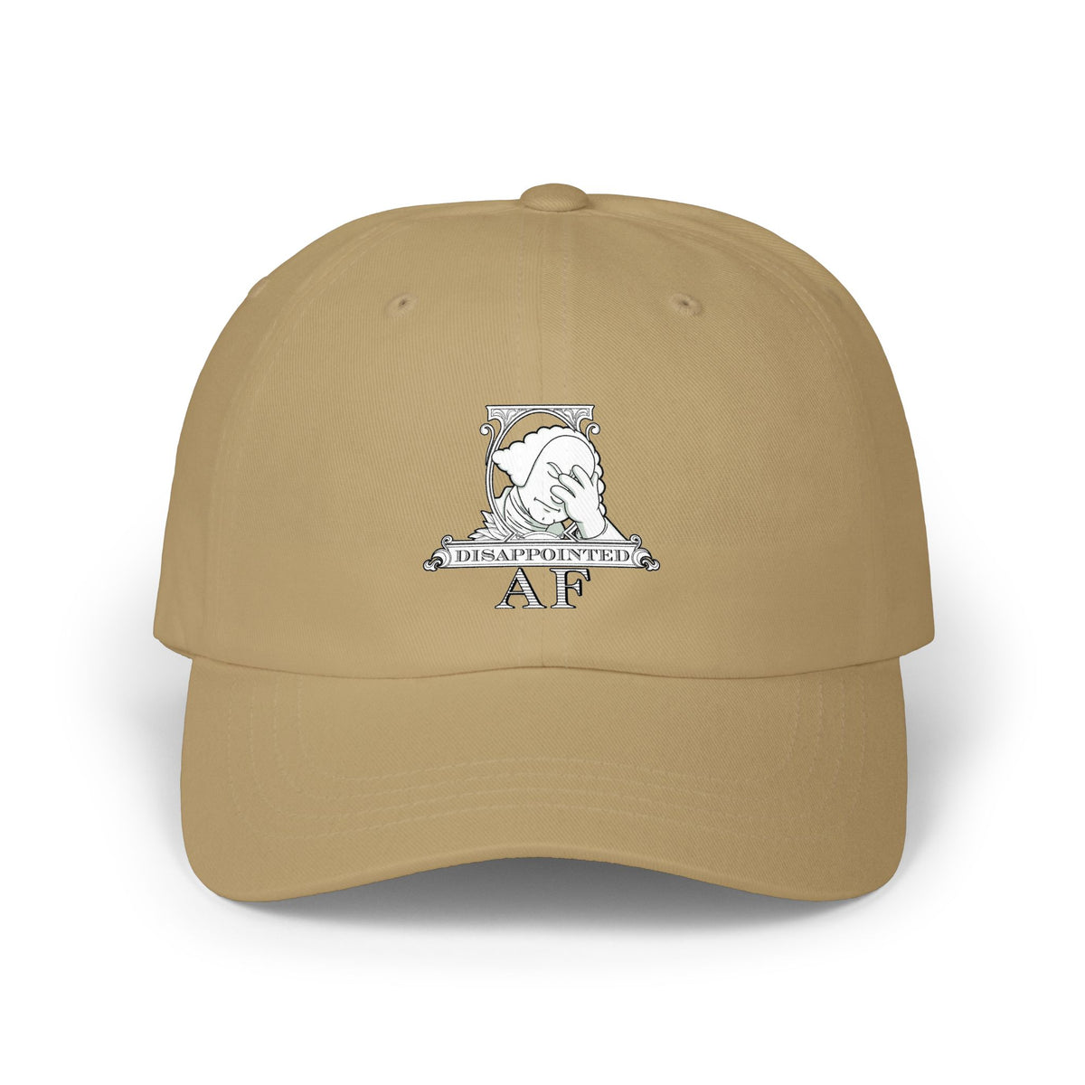 A tan baseball cap with a white graphic on the front depicting Disappointed AF's logo. The logo is framed with scrolls, similar to that of a dollar bill, with George Washington in the center. George Washington looks disappointed and has his head in his hand.