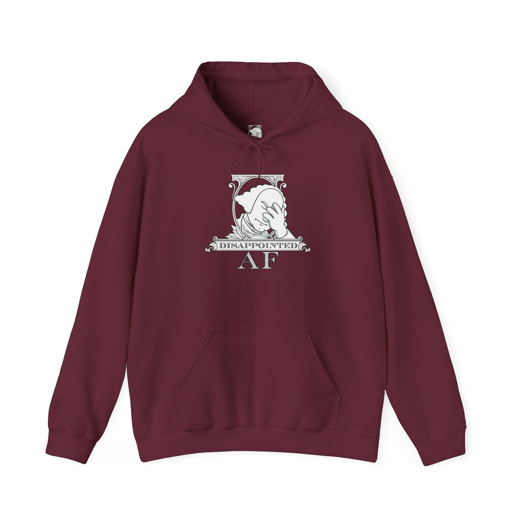 Maroon hoodie on a white background with a black and white logo in the center of the hoodie. This is the logo for Disappointed AF and is framed with scrolls, similar to that of a dollar bill, with George Washington in the center. George Washington looks disappointed and has his head in his hand. below the logo it says Disappointed AF